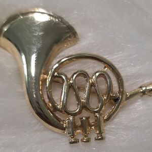 Elegant Gold French Horn Brooch